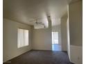 Bright living room featuring plush carpeting and a large window at 6340 Cranberry Ln, Las Vegas, NV 89156
