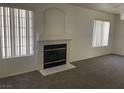 Inviting living room boasting a cozy fireplace, and neutral color palette at 6340 Cranberry Ln, Las Vegas, NV 89156