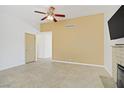 Open concept living room featuring tiled floors, modern paint and fireplace at 6358 Meadow Lark Ln, Las Vegas, NV 89103
