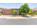 Attractive single-story home boasts a well-maintained front yard and two-car garage at 6810 Silver Crescent St, Las Vegas, NV 89148