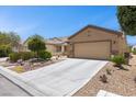 Lovely single-story home with a well-kept yard, mature trees, and a spacious two-car garage at 7817 Homing Pigeon St, North Las Vegas, NV 89084