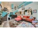 Bright living room featuring an open staircase and stylish decor at 8713 Nautical Bay Ln, Las Vegas, NV 89117