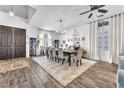 Spacious dining area with a large table, stylish decor, and ample natural light, perfect for Gathering gatherings at 10654 Sidlaw Hills Ct, Las Vegas, NV 89141