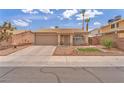 Cozy single story home featuring desert landscaping and a two car garage at 1468 Harmony Hill Dr, Henderson, NV 89014