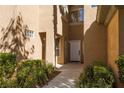 Inviting front entrance with well-manicured landscaping and a cozy feel at 1609 Hills Of Red Dr # 104, Las Vegas, NV 89128