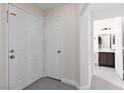 Hallway with tile flooring leading to a bathroom and other rooms at 1609 Hills Of Red Dr # 104, Las Vegas, NV 89128