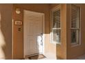 Close-up of a white front door with visible house number and sidelight at 1609 Hills Of Red Dr # 104, Las Vegas, NV 89128