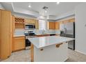 Well-equipped kitchen features stainless steel appliances, ample counter space and a center island at 5717 Heineken Dr, North Las Vegas, NV 89031