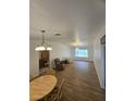 Spacious living room with hardwood floors and ample natural light at 6284 Explorer Dr, Las Vegas, NV 89103