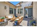 Cozy outdoor patio with comfortable seating, string lights, and stylish decor, perfect for relaxing or entertaining guests at 704 Webber Park St, Henderson, NV 89011