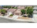 Aerial view of a well-maintained home in a neighborhood with mature trees and easy access to nearby amenities at 7137 Eyebright St, Las Vegas, NV 89131