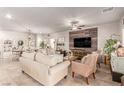 Bright living room featuring neutral colors, wood accent wall, and an open floor plan at 7824 Warm Winds St, North Las Vegas, NV 89084