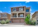 Lovely two-story home with stone accents, a balcony, and three-car garage at 8565 Silver Coast St, Las Vegas, NV 89139