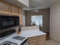 Bright kitchen view showcases gas range, microwave and a view to the adjacent dining area at 9000 Las Vegas Blvd # 1142, Las Vegas, NV 89123