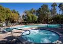 Community pool features a heated spa, ample seating and mature shade trees at 9000 Las Vegas Blvd # 1142, Las Vegas, NV 89123