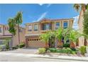 Gorgeous two-story home featuring a well-maintained lawn and a two-car garage at 9729 Hawk Crest St, Las Vegas, NV 89141