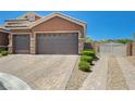 Property with a three-car garage and additional gated parking at 334 Cougar Estates Ln, Las Vegas, NV 89123