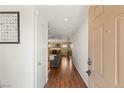 Inviting entryway with hardwood floors leading into the living and dining areas at 10253 Martinsburg Ct, Las Vegas, NV 89183