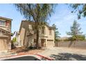 Charming two-story home with a one-car garage and a well-maintained front yard at 10253 Martinsburg Ct, Las Vegas, NV 89183