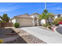 Attractive single story home featuring a two car garage and desert landscaping at 10613 Tiffanieville Ct, Las Vegas, NV 89129