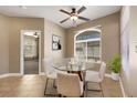 Cozy dining area with a round glass table, seating for four, and large window at 108 Lemon Glaze St # 202, Las Vegas, NV 89145