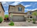 Lovely two-story home showcasing a two-car garage and neat front yard landscaping at 1425 Overseer Ave, Henderson, NV 89074