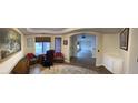 Inviting office space with wood floors, neutral paint, and an archway leading to an open area at 3051 S Rainbow Ave, Pahrump, NV 89048