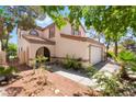 Charming home with stucco and desert landscaping; entryway with portico and attached garage at 3200 Mariner Bay St, Las Vegas, NV 89117