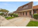 Brick home featuring a unique architectural design and well-maintained front yard at 3471 One Nation Ave, Las Vegas, NV 89121