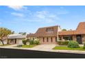 Quaint home with a neatly landscaped front yard and unique roofline at 3471 One Nation Ave, Las Vegas, NV 89121