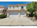 Charming two-story home with tile roof, mature landscaping, and attached two-car garage at 3873 Palm Island Ct, Las Vegas, NV 89147