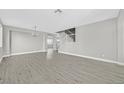 Spacious living room with hardwood floors and neutral walls that create a bright open space at 600 Baysville Ct, Las Vegas, NV 89144