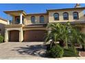 Stunning two-story home with a tile roof, balcony, manicured landscaping, and a spacious three-car garage at 6277 Mustang Spring Ave, Las Vegas, NV 89139