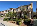 Charming two-story home featuring a tiled roof, balcony, and lush landscaping adding curb appeal at 6277 Mustang Spring Ave, Las Vegas, NV 89139