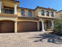 Elegant two-story home showcasing a tile roof, balcony, grand pillars, and a spacious three-car garage at 6277 Mustang Spring Ave, Las Vegas, NV 89139