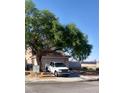 A pleasant single-Gathering home with mature landscaping, a mailbox, and a two-car garage at 7528 Golden Yucca Dr, Las Vegas, NV 89147