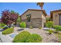 Charming single-story home with stone accents, desert landscaping, and a mature shade tree at 7609 Slide Rock Ave, Las Vegas, NV 89113