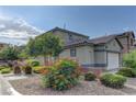 A spacious home with a well-manicured lawn and mature landscaping at 7919 Dexter Falls St, Las Vegas, NV 89149