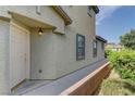 Charming front door with sidelight, set in a stucco wall at 7919 Dexter Falls St, Las Vegas, NV 89149