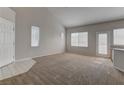 Spacious living room featuring a large window for natural light and neutral walls at 7919 Dexter Falls St, Las Vegas, NV 89149