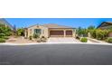 Beautiful exterior of a single-story home with a two-car garage and desert landscaping at 8298 W Agate Ave, Las Vegas, NV 89113