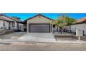 Charming one-story home with a well-maintained front yard and a two-car garage at 8412 Mulcahy Ave, Las Vegas, NV 89145