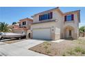 Charming two-story home featuring a two-car garage, boat, and desert landscaping at 8529 Gold Flash Ave, Las Vegas, NV 89129