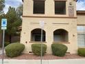 Condo exterior featuring clearly visible signage indicating reserved accessible parking at 10290 Gilmore Canyon Ct # 103, Las Vegas, NV 89129