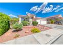 Beautiful single-story home featuring desert landscaping, tiled roof, and two-car garage at 1126 Winter Storm Dr, Henderson, NV 89052
