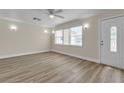 Inviting living room featuring a new front door, recessed lighting, and modern flooring at 120 Dogwood St, Henderson, NV 89015