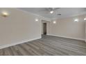 Bright living room with new floors, modern lighting and crown molding at 120 Dogwood St, Henderson, NV 89015