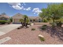 A delightful single-story home featuring desert landscaping and a welcoming front entrance at 1620 Fieldbrook St, Henderson, NV 89052