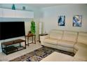 Bright living room featuring a modern white leather sofa, sleek furniture, and stylish decor at 2659 Vegas Valley Dr, Las Vegas, NV 89121