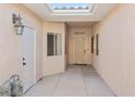 Inviting entryway features a skylight, decorative door, and neutral color scheme at 3161 Quail Song Dr # 3161, Laughlin, NV 89029
